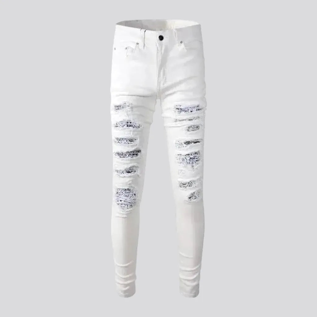 Distressed painted-patches jeans for men